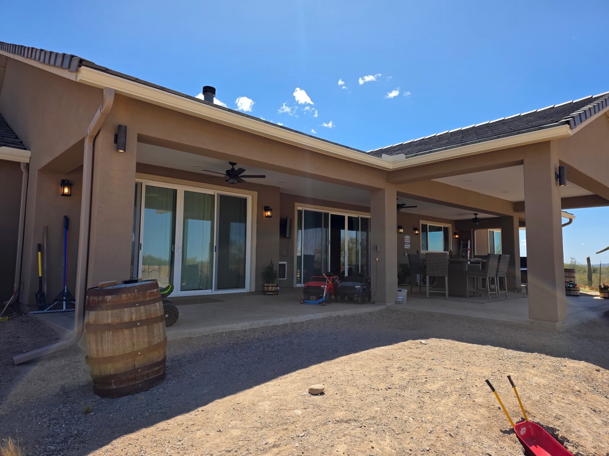 Seamless gutter running the full patio cover of a custom Tucson home