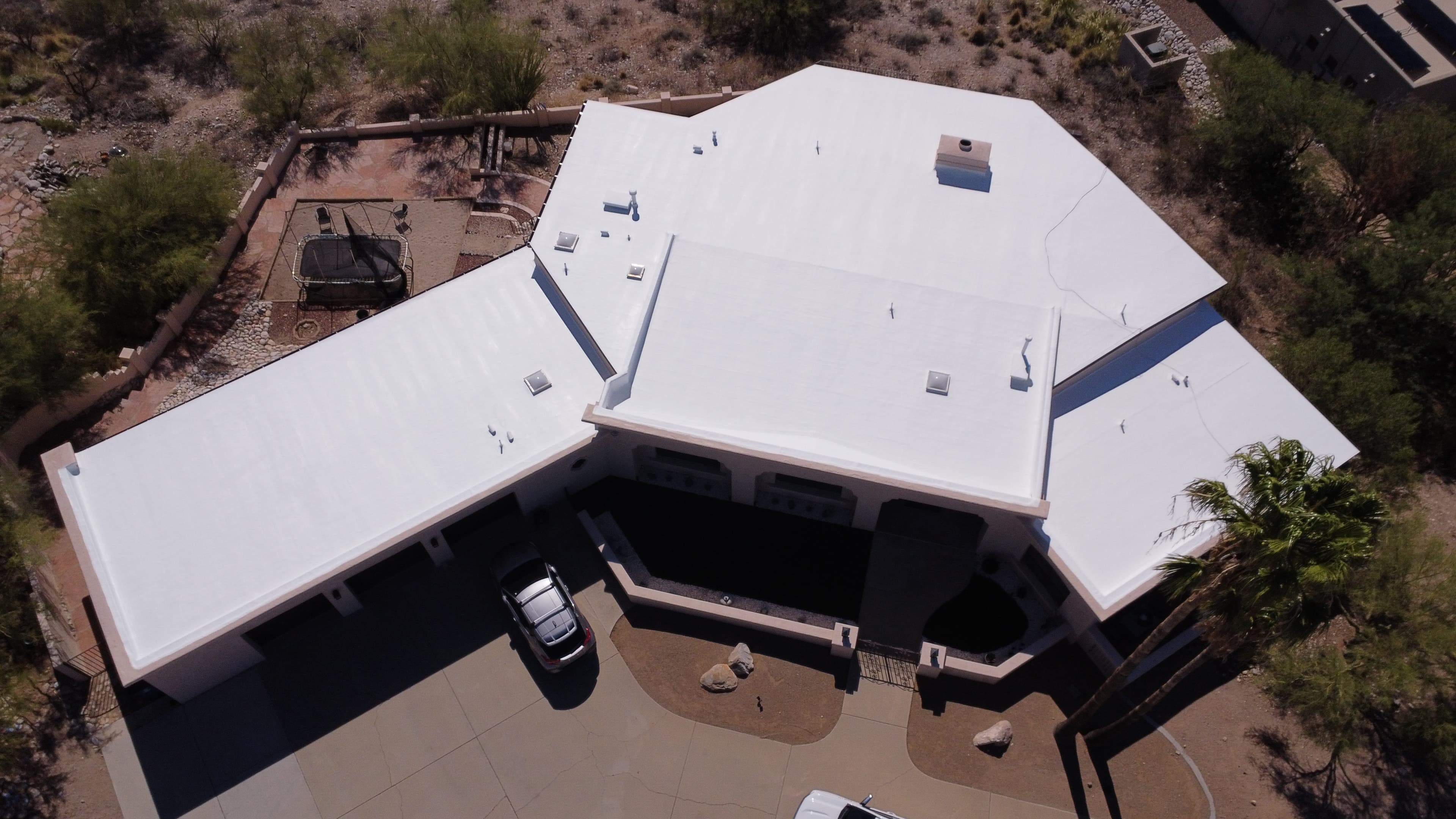 Large multi-section flat-roof commercial property in Tucson, drone view